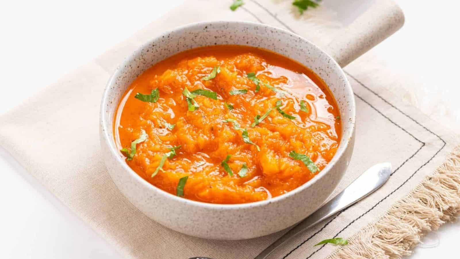 Close up of spaghetti squash soup in a white bowl.