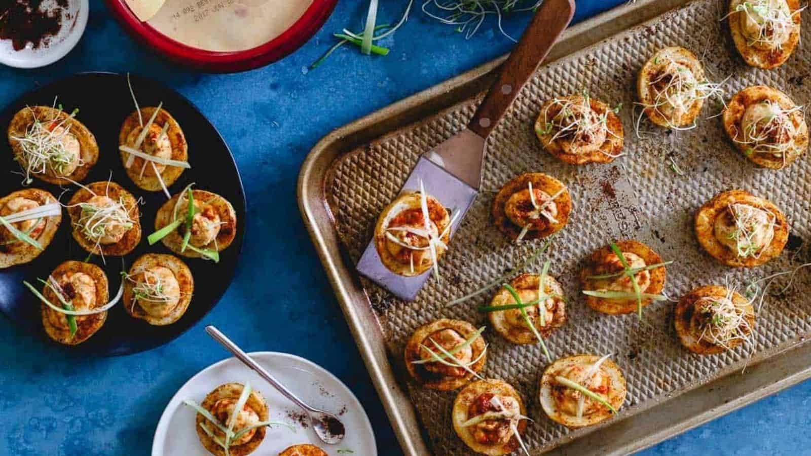 Top view of spicy hummus stuffed roasted potato cups.