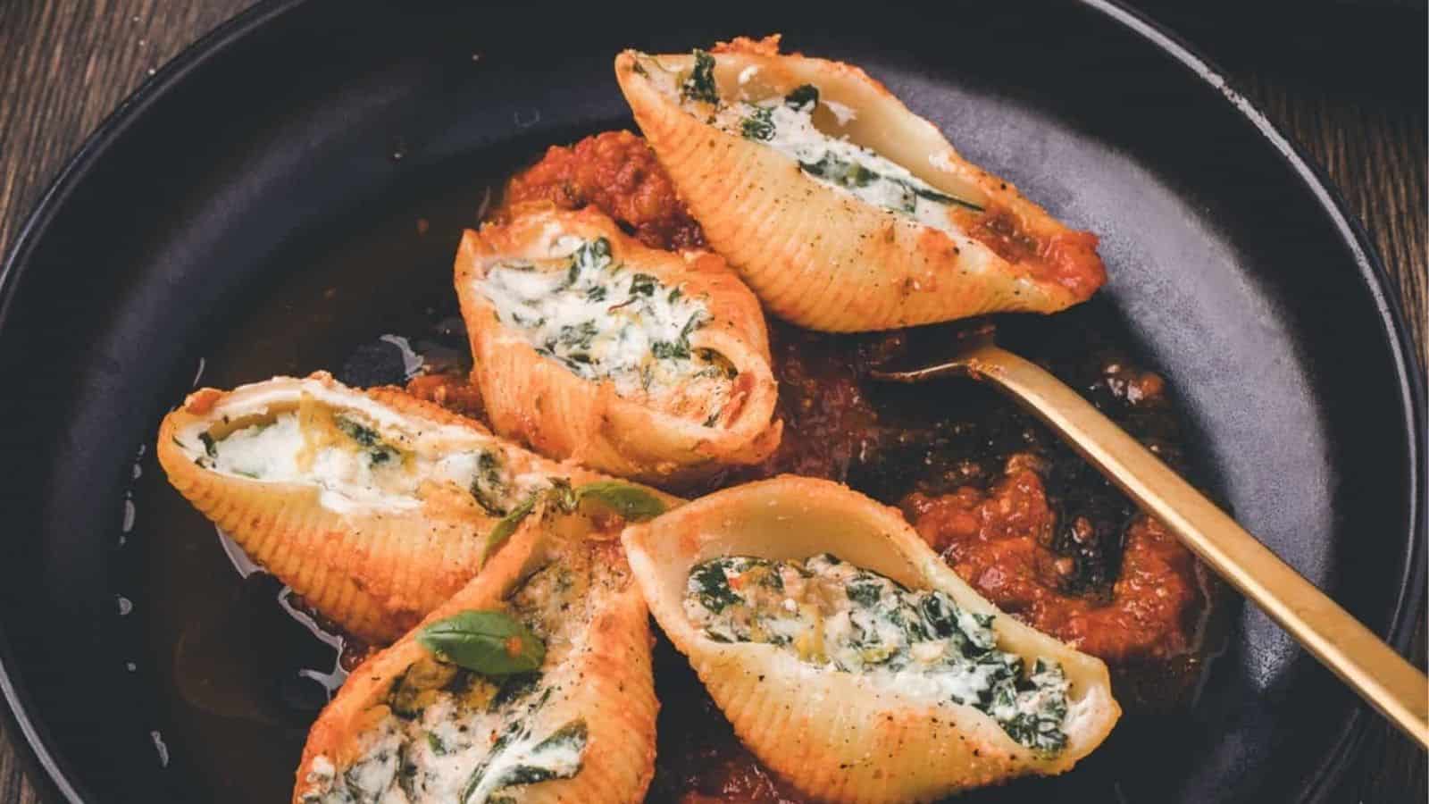 Stuffed shells in a cast iron skillet.