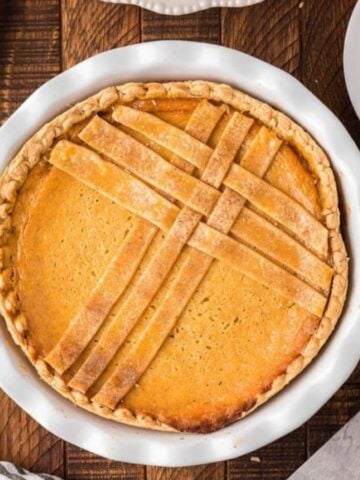 Top view of sweeet italian ricotta pie on a plate.