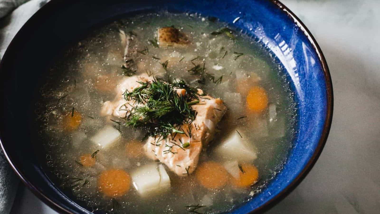 Overhead view of blue bowl of soup.