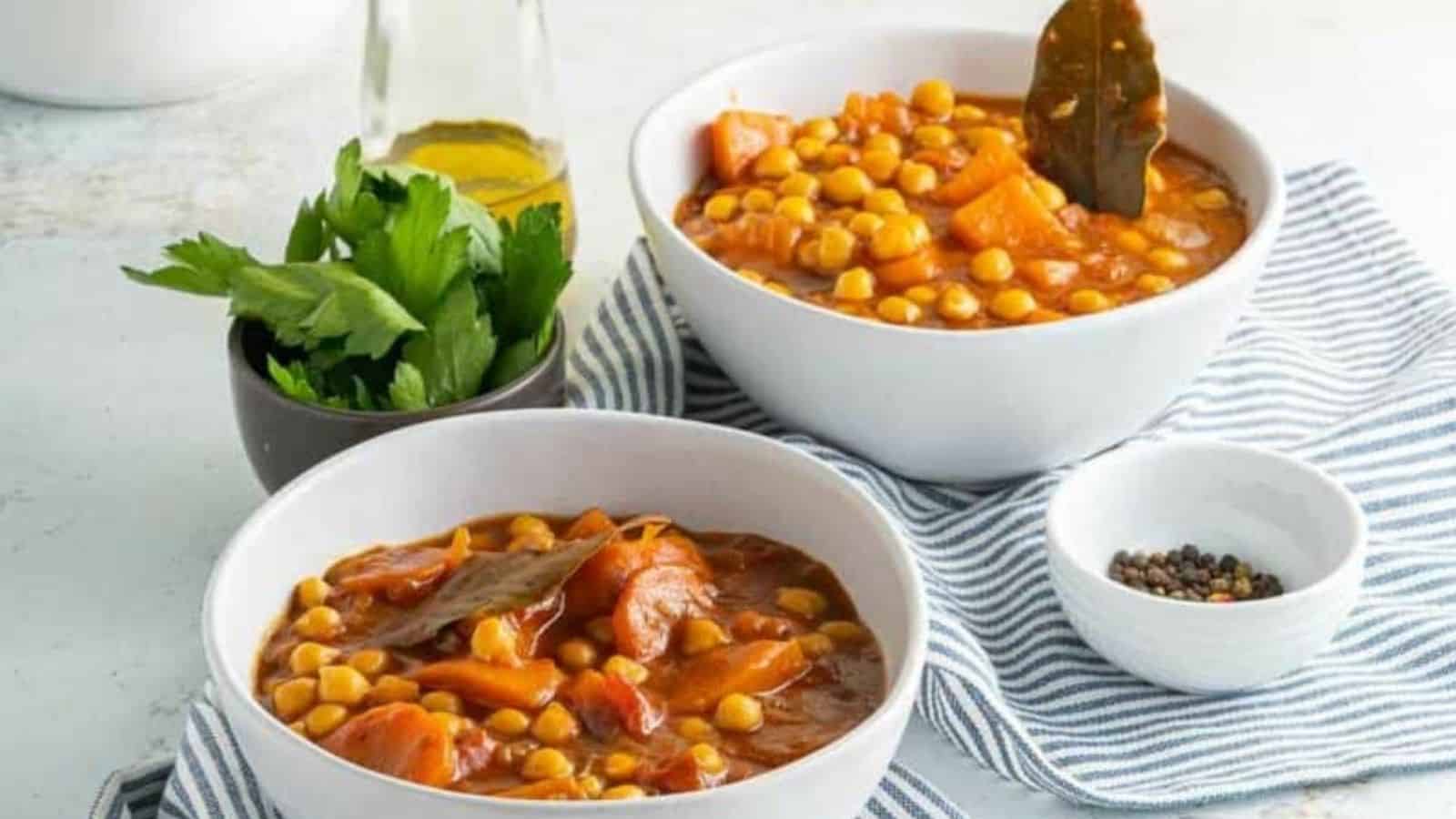 Two bowls of vegan chickpea and sweet potato stew.