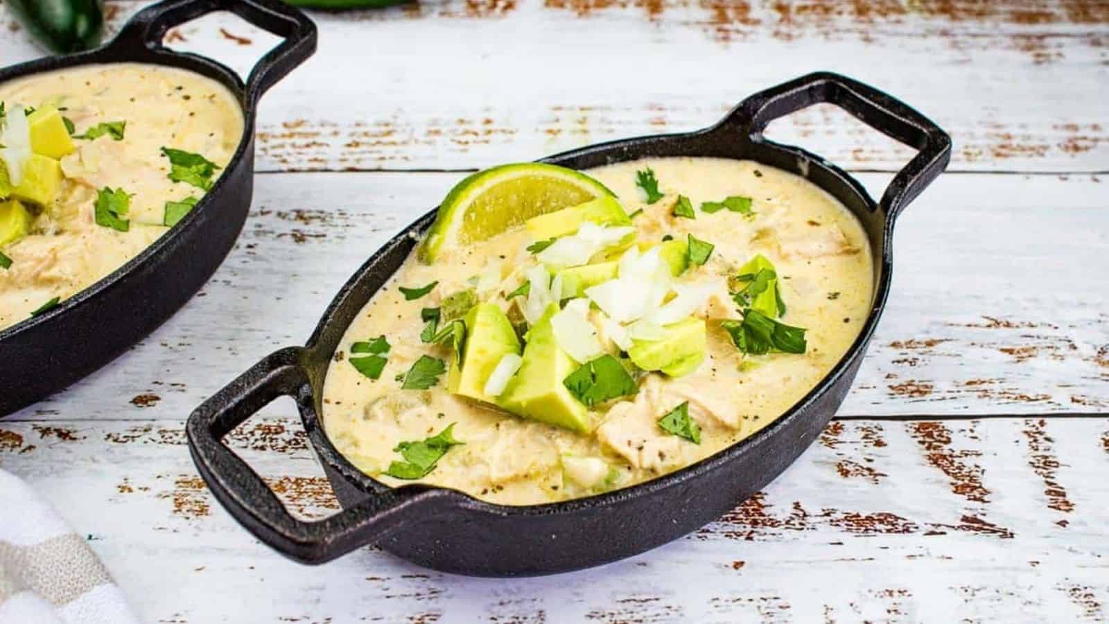 Two cast iron bowls filled with White Chicken Chili.