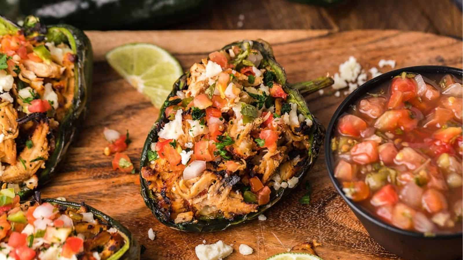 Close-up image of air fryer fiesta chicken stuffed poblano peppers.