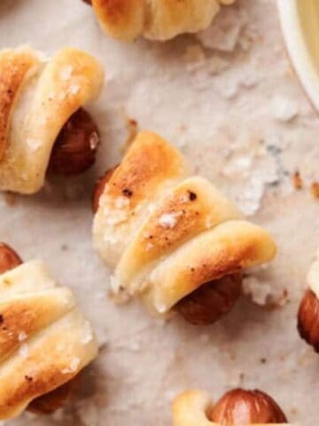 Top view of air fryer pigs in a blanket with dip.