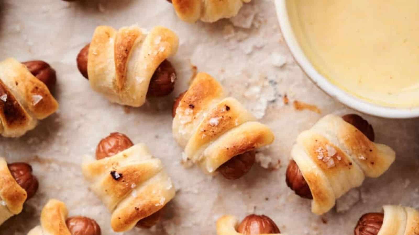 Top view of air fryer pigs in a blanket with dip.