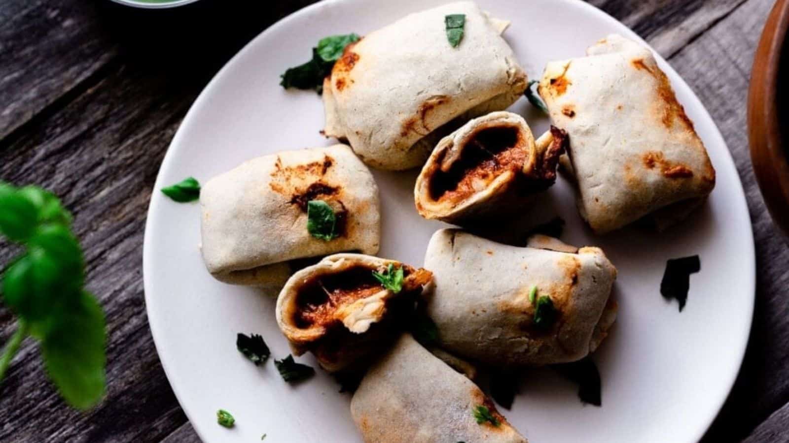 Overhead image of air fryer pizza rolls on a plate.