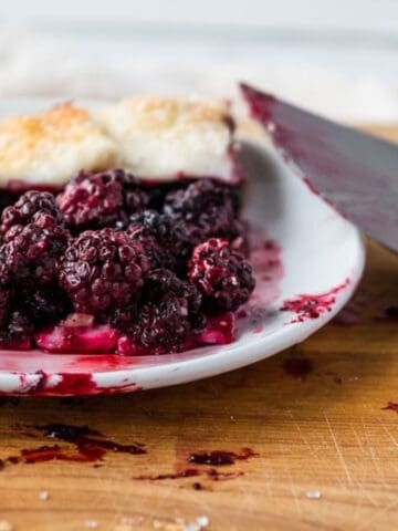 Blueberry galette topped with whipped cream.