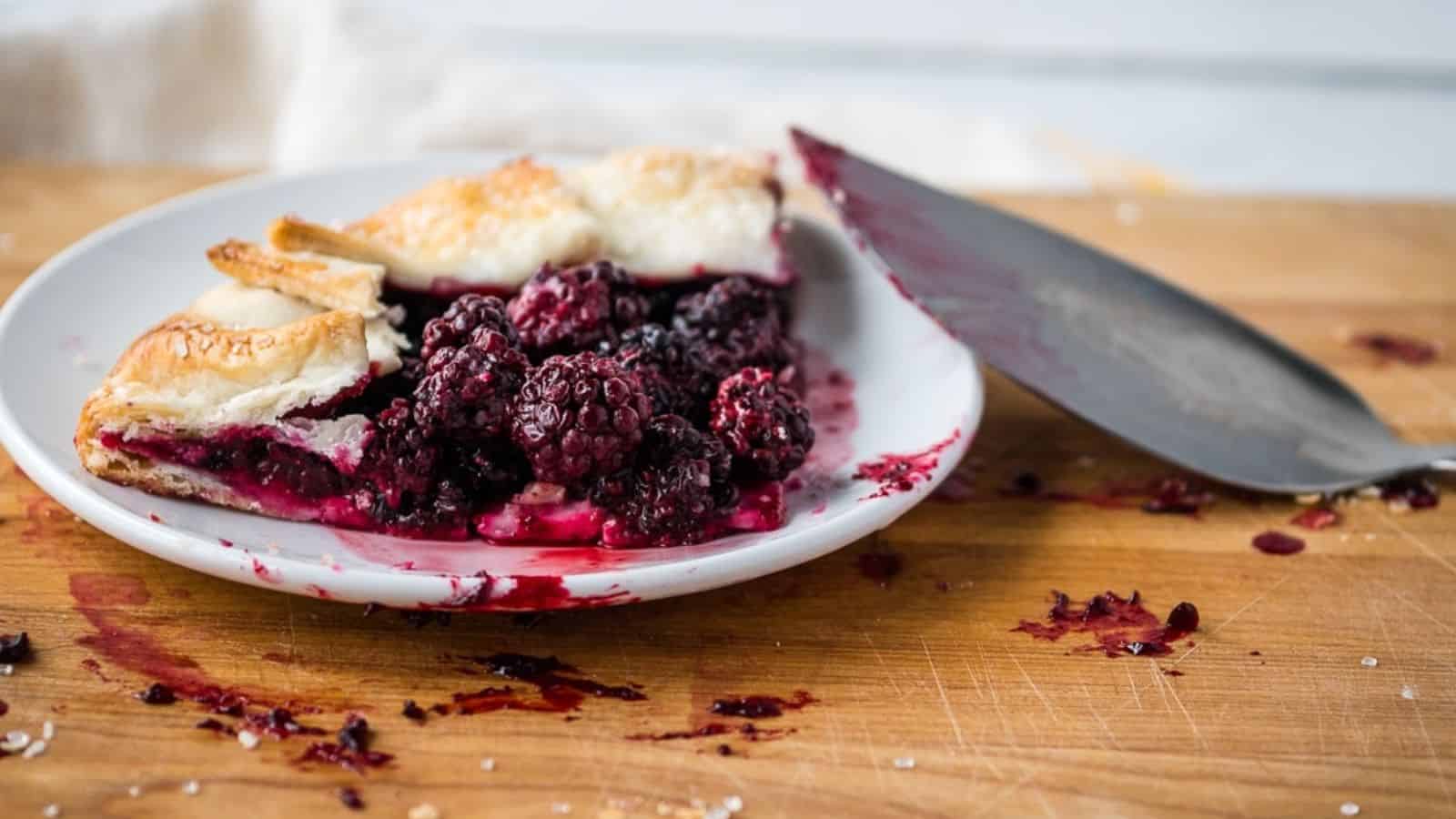 Blueberry galette topped with whipped cream.