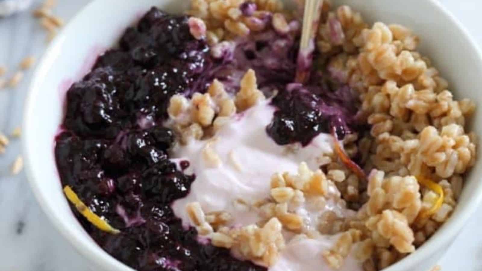 Close-up image of blueberry farro yogurt bowl.