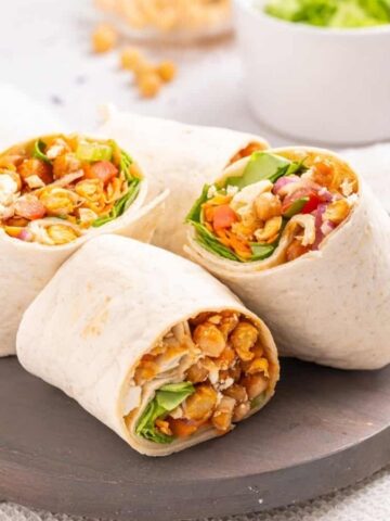An image of buffalo chickpea wraps on a plate.