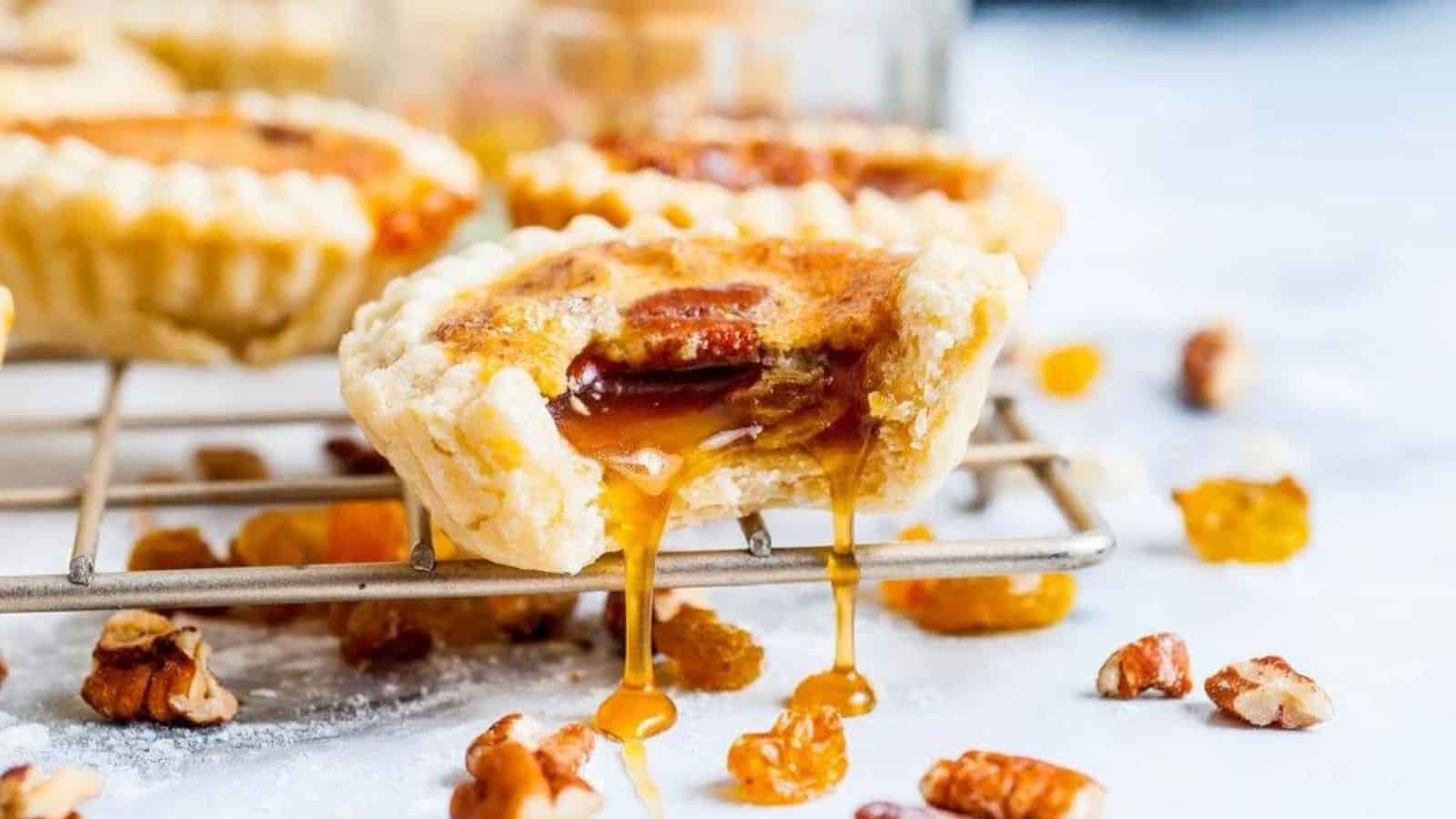 Close-up image of canadian butter tarts on a cooling rack.