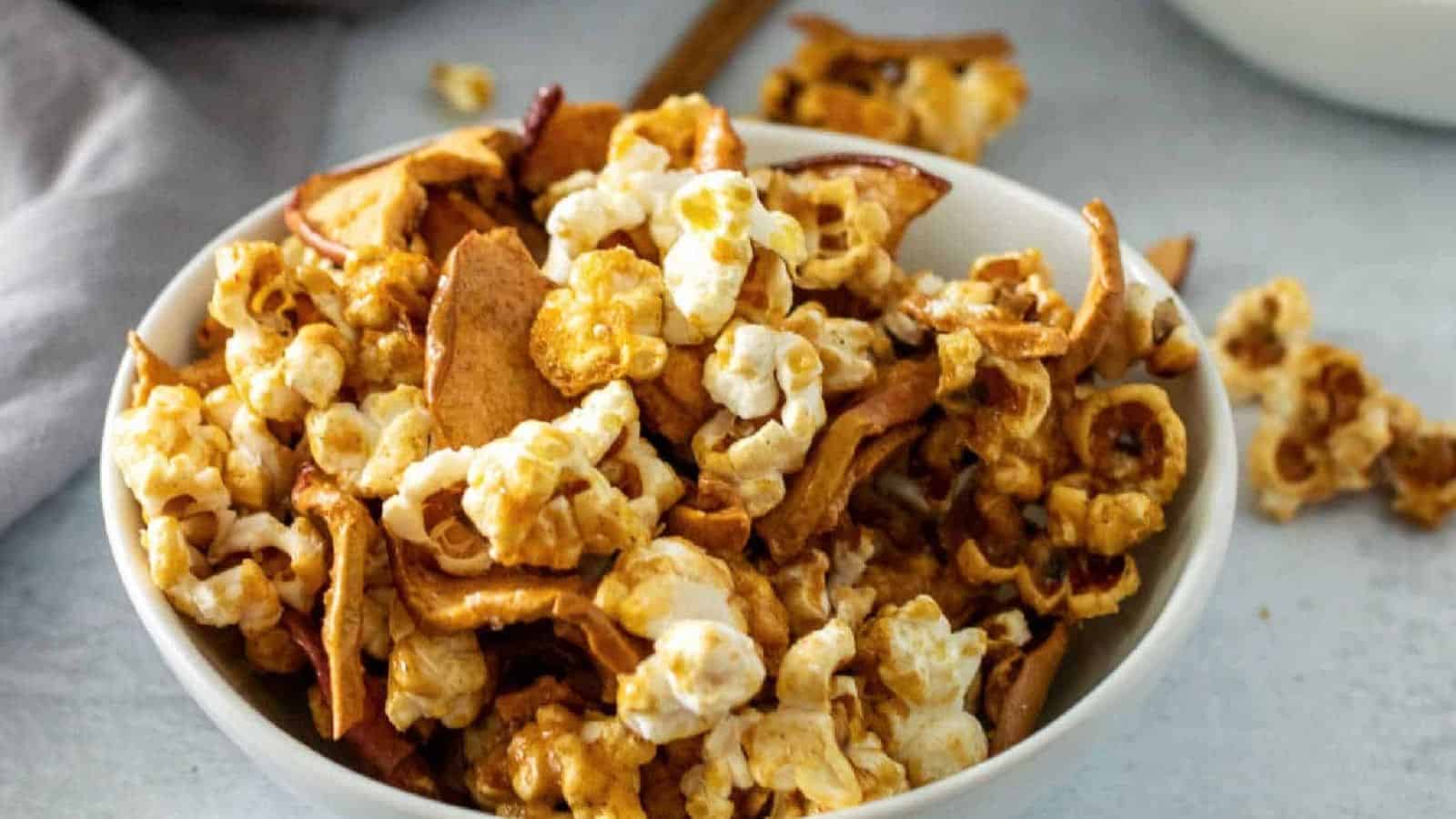 A white bowl with caramel apple popcorn.