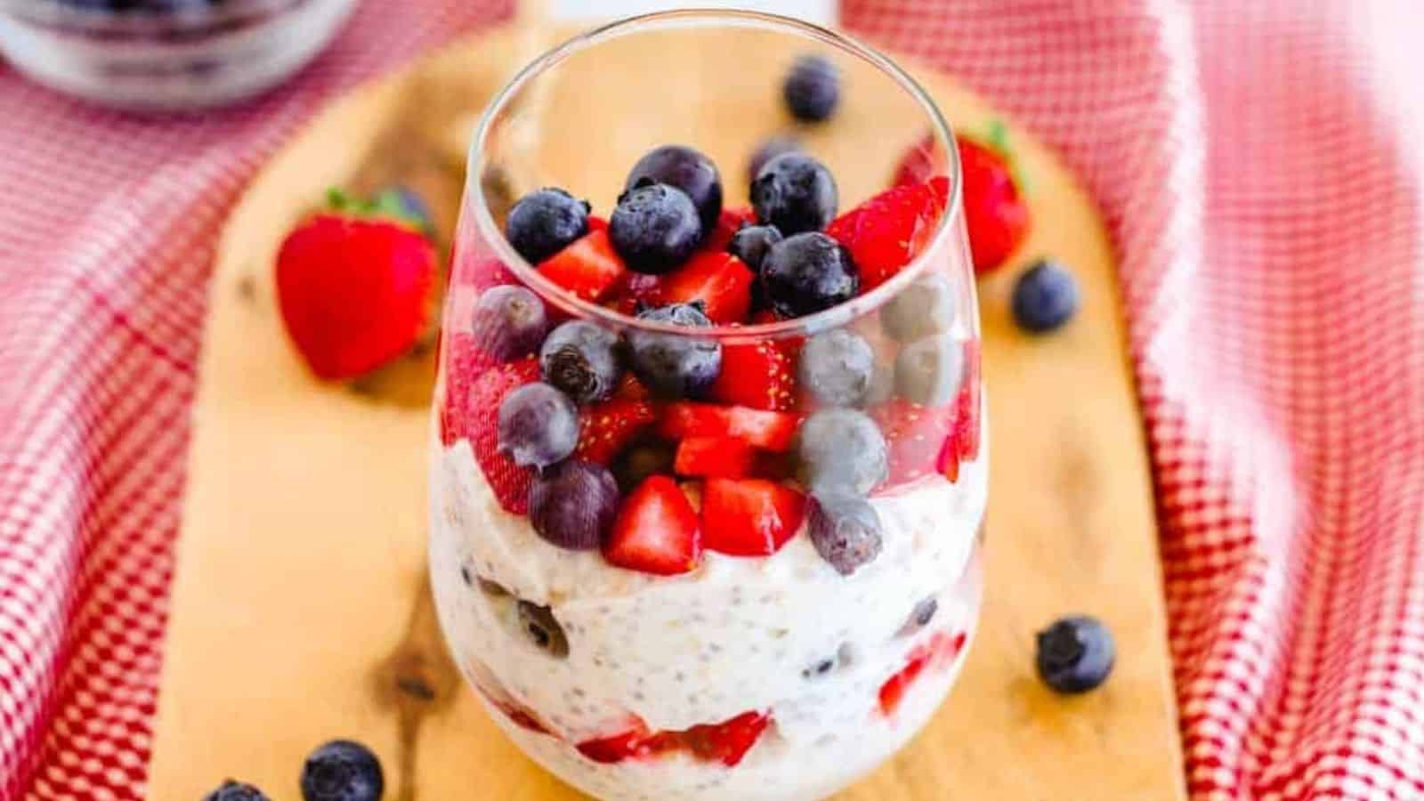 Chia Overnight Oats in a glass with fresh berries.