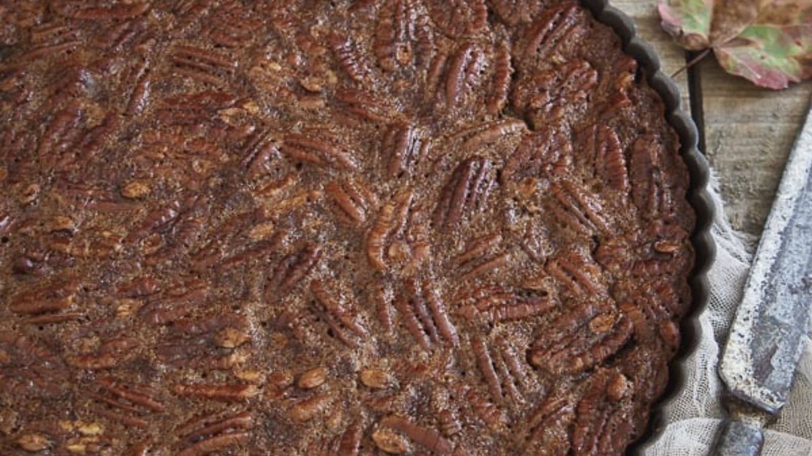 Close-up image of chocolate pecan tart.