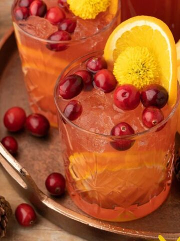 Two glasses of Cranberry Orange Prosecco Punch.