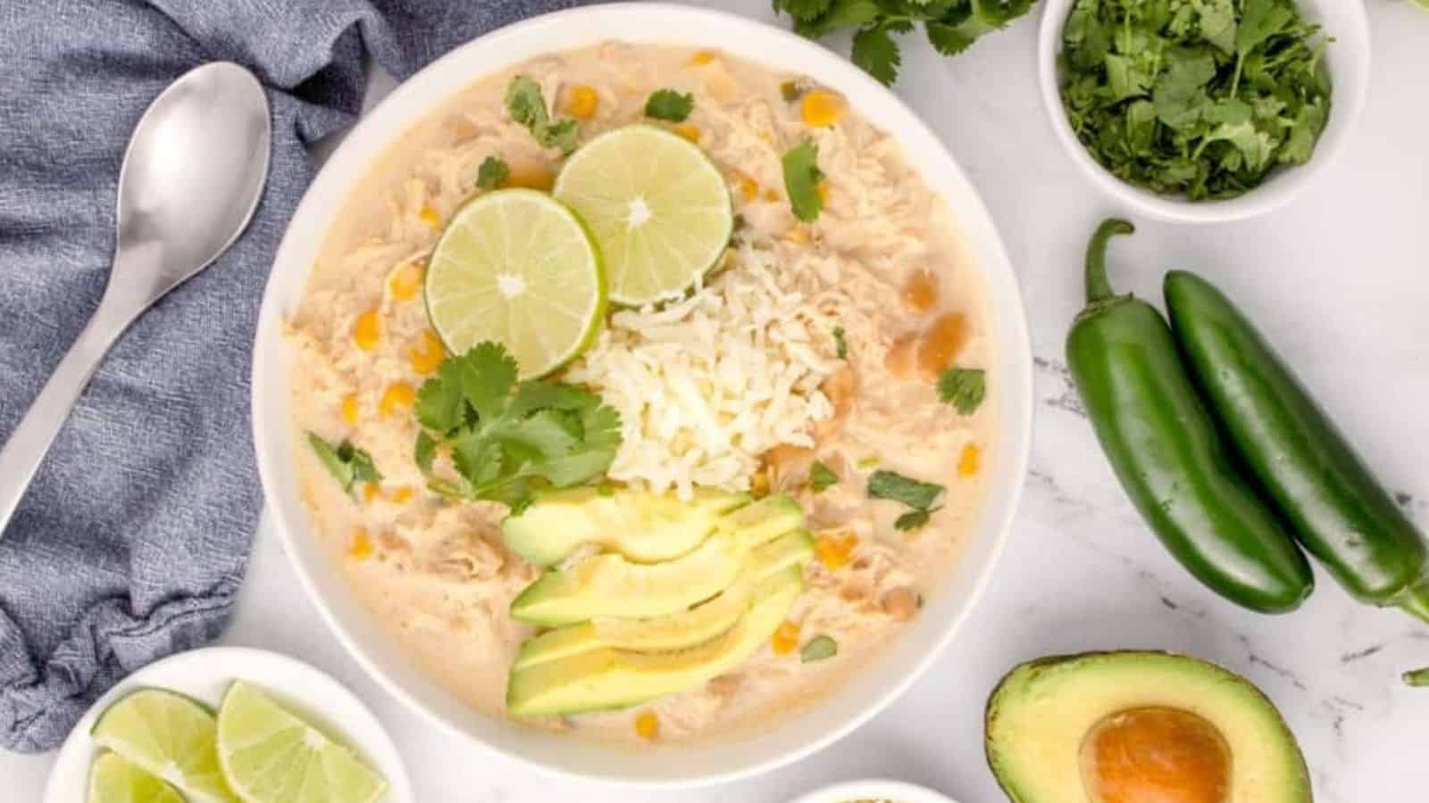 Overhead image of creamy white chicken chili in a bowl.