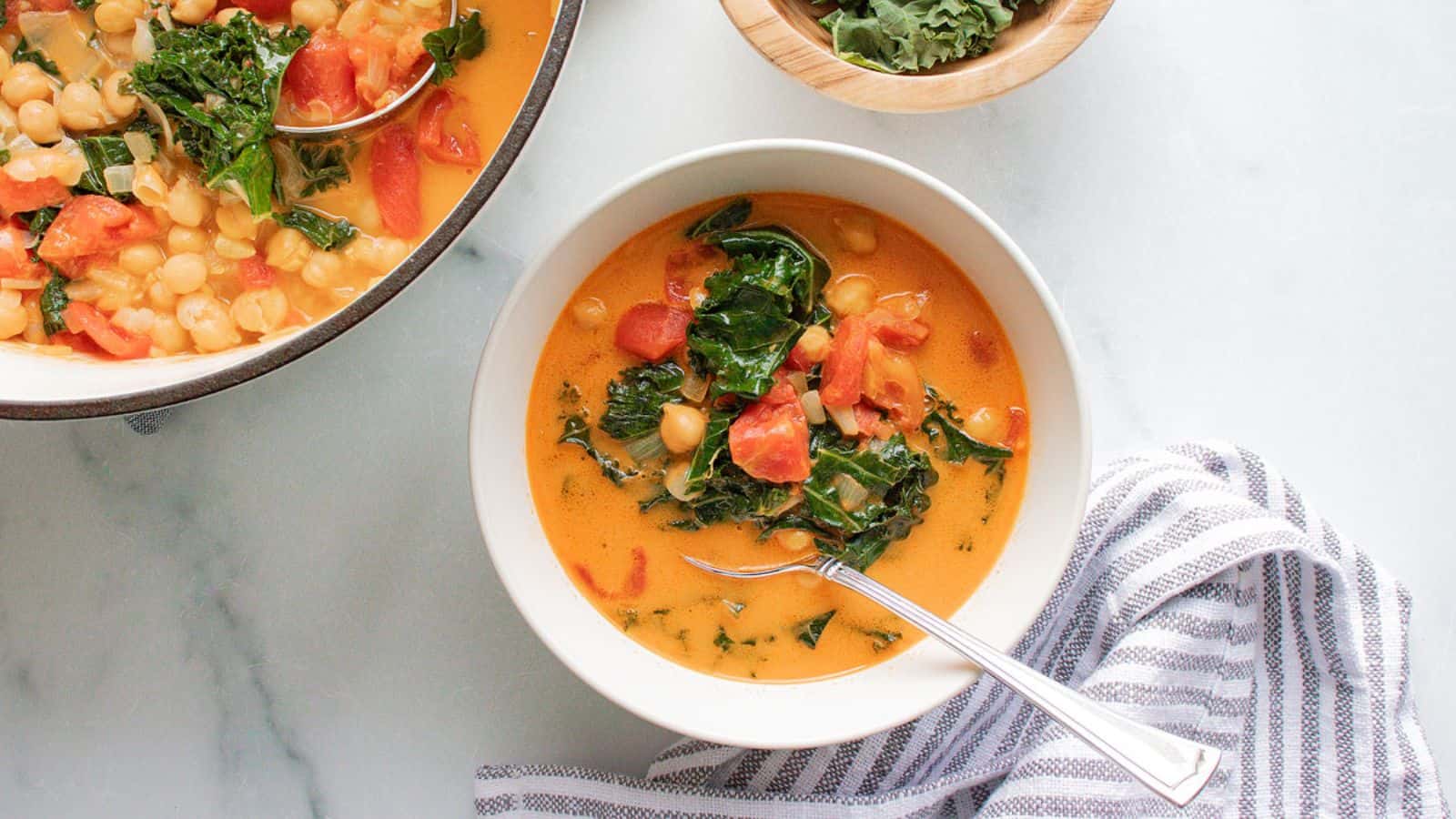 A bowl of Curry Coconut Chickpea Stew with a spoon.