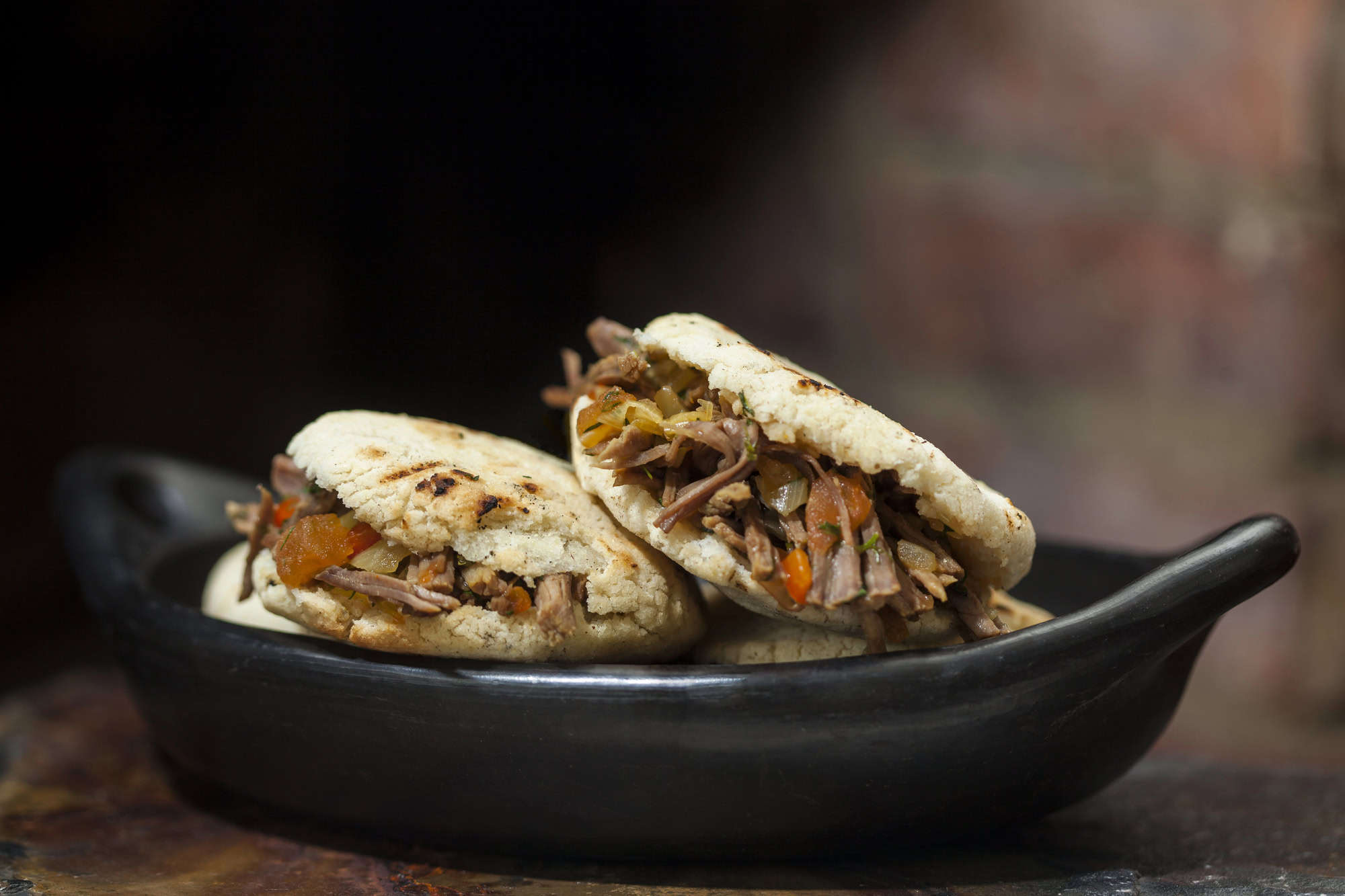 Arepas filled with shredded beef.