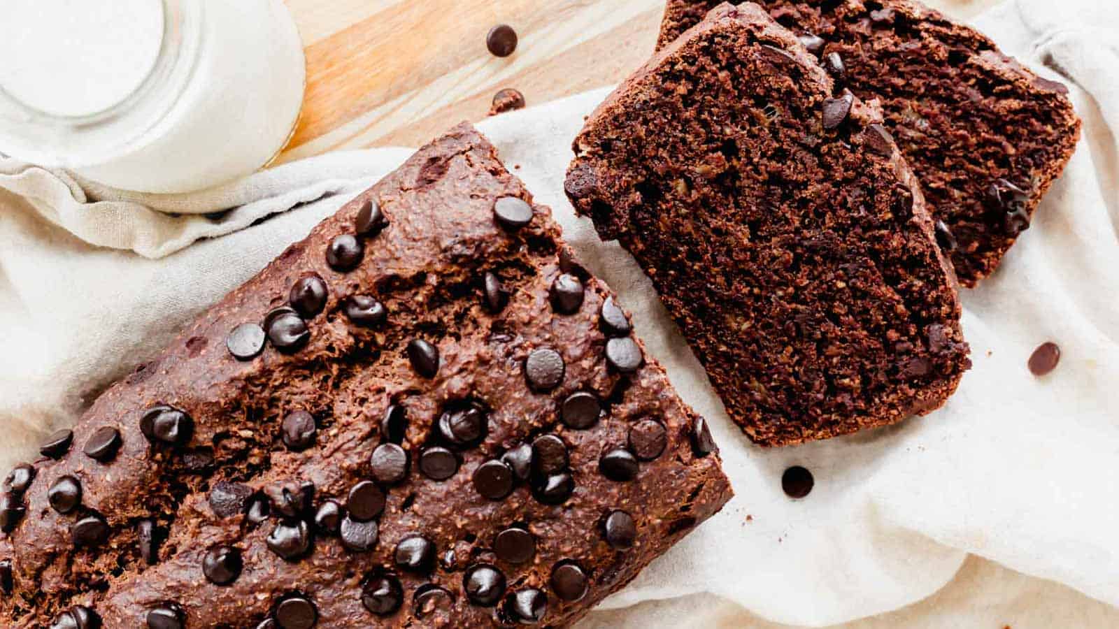 Double chocolate banana bread with chocolate chips sliced on a cutting board.