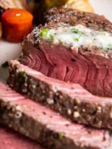 Close-up of sliced air fryer fillet mignon on a plate.