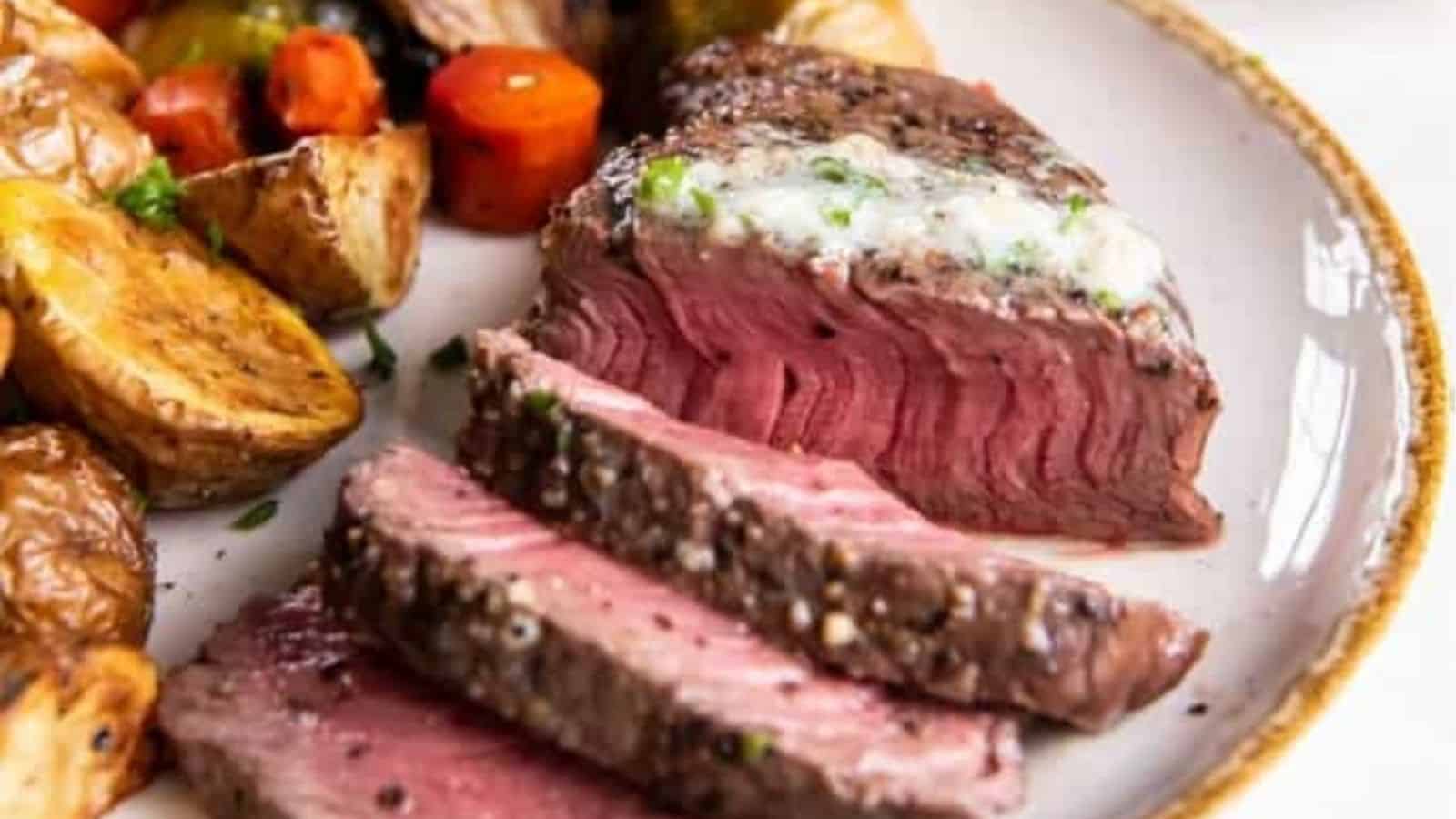 Close-up of sliced air fryer fillet mignon on a plate.