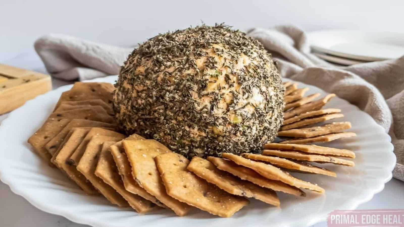 Nut-free cheese ball and crackers on a plate.