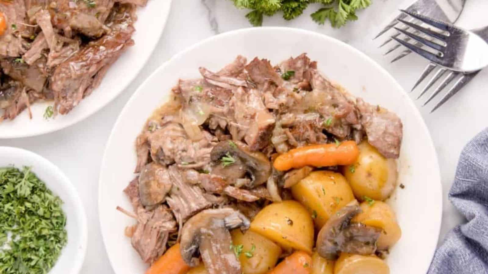 Overhead image of easy pot roast crock pot on a plate.