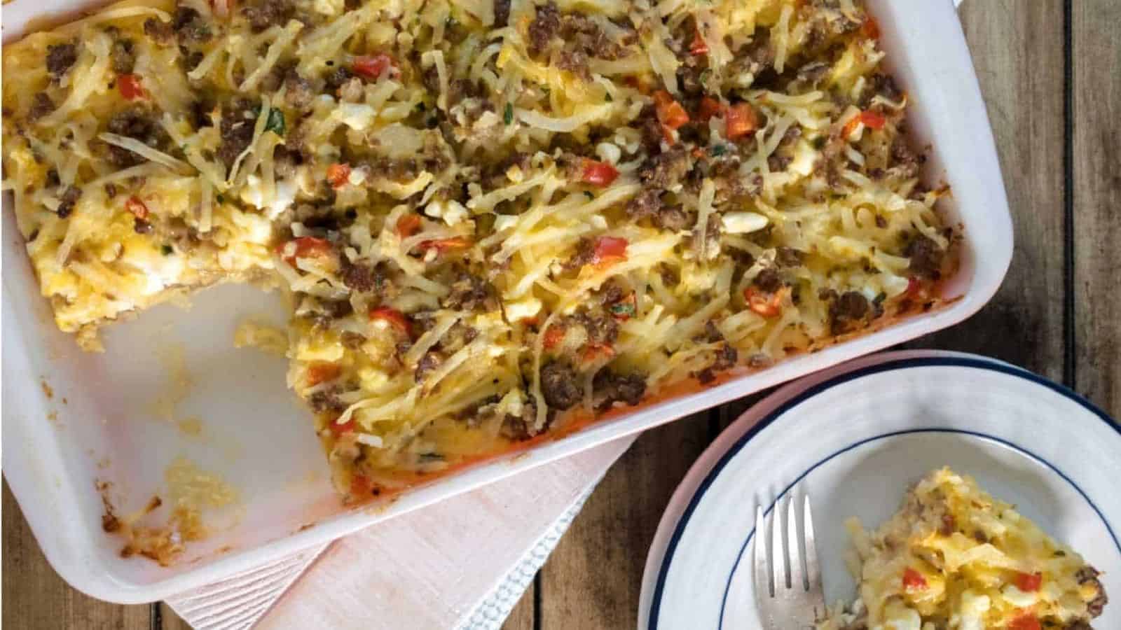 A hashbrown casserole in a white baking dish.