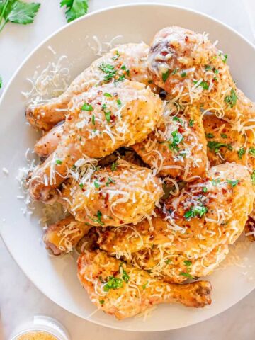 Top view of a plate full of Garlic Parmesan Sheet Pan Chicken Drumsticks.