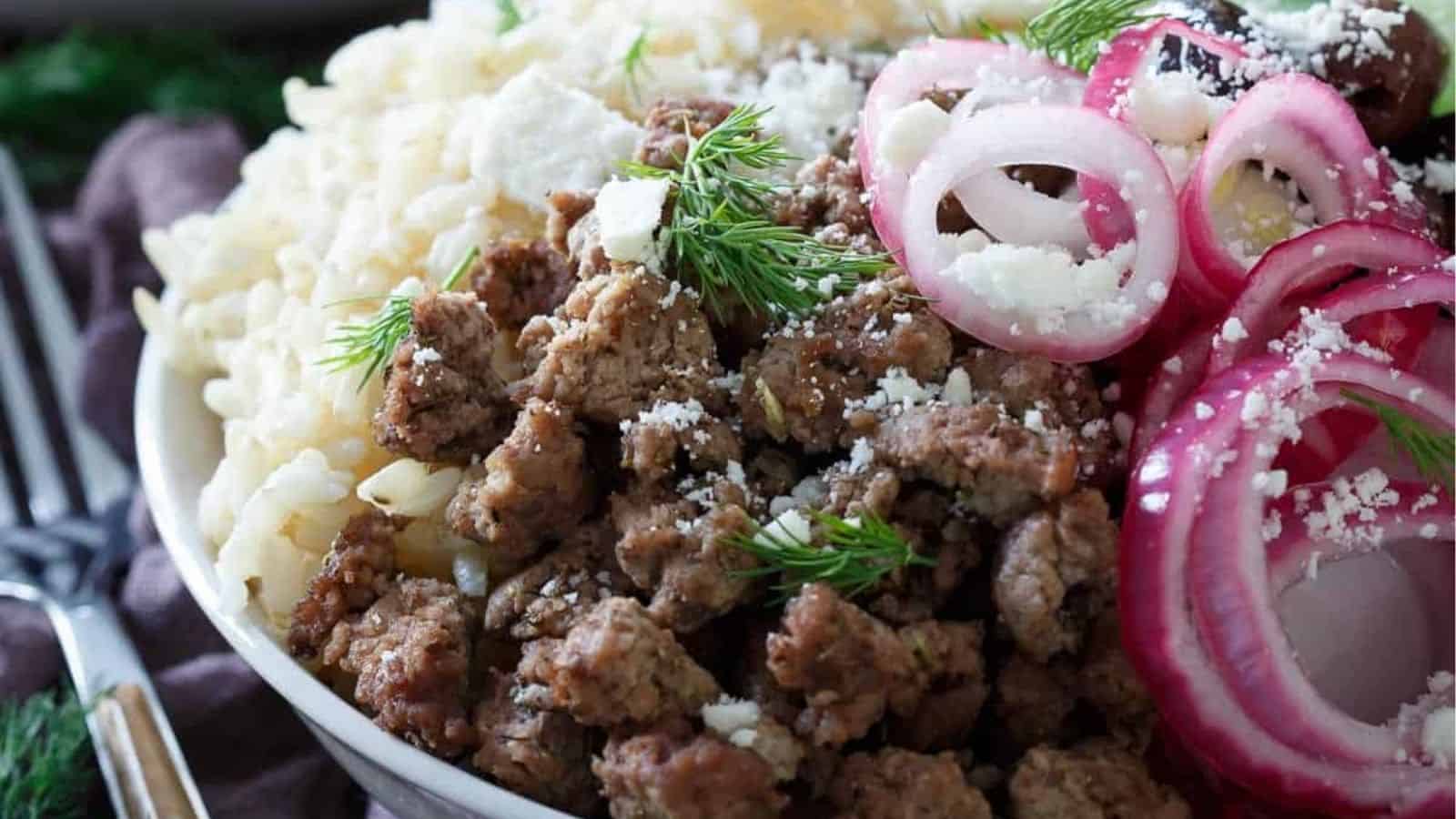 Close-up image of greek brown rice bowl.