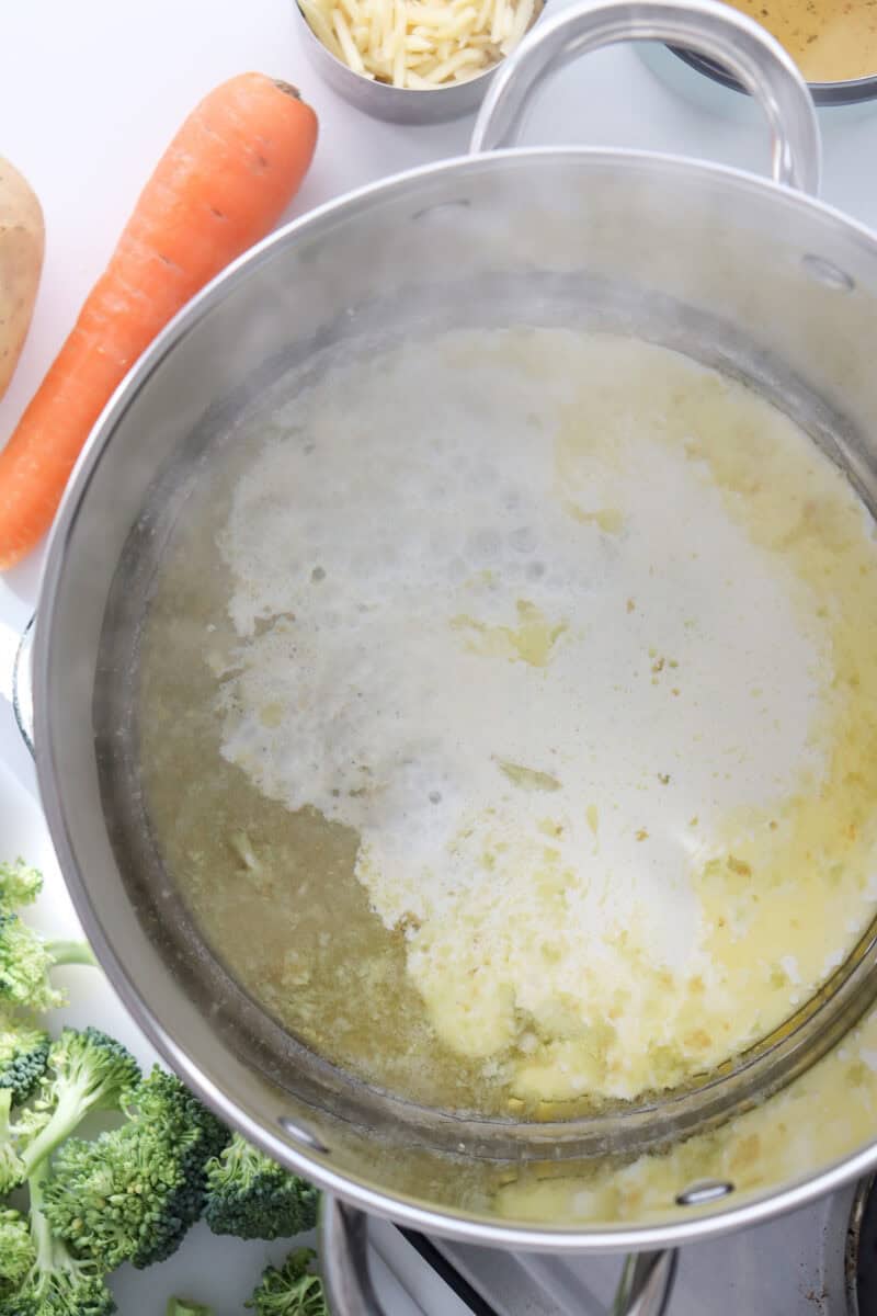 An overhead image of boiling soup in a pot.