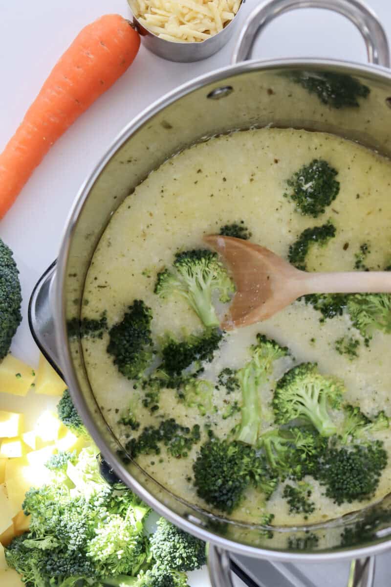 Overhead image of broccoli cheddar soup in a pot.