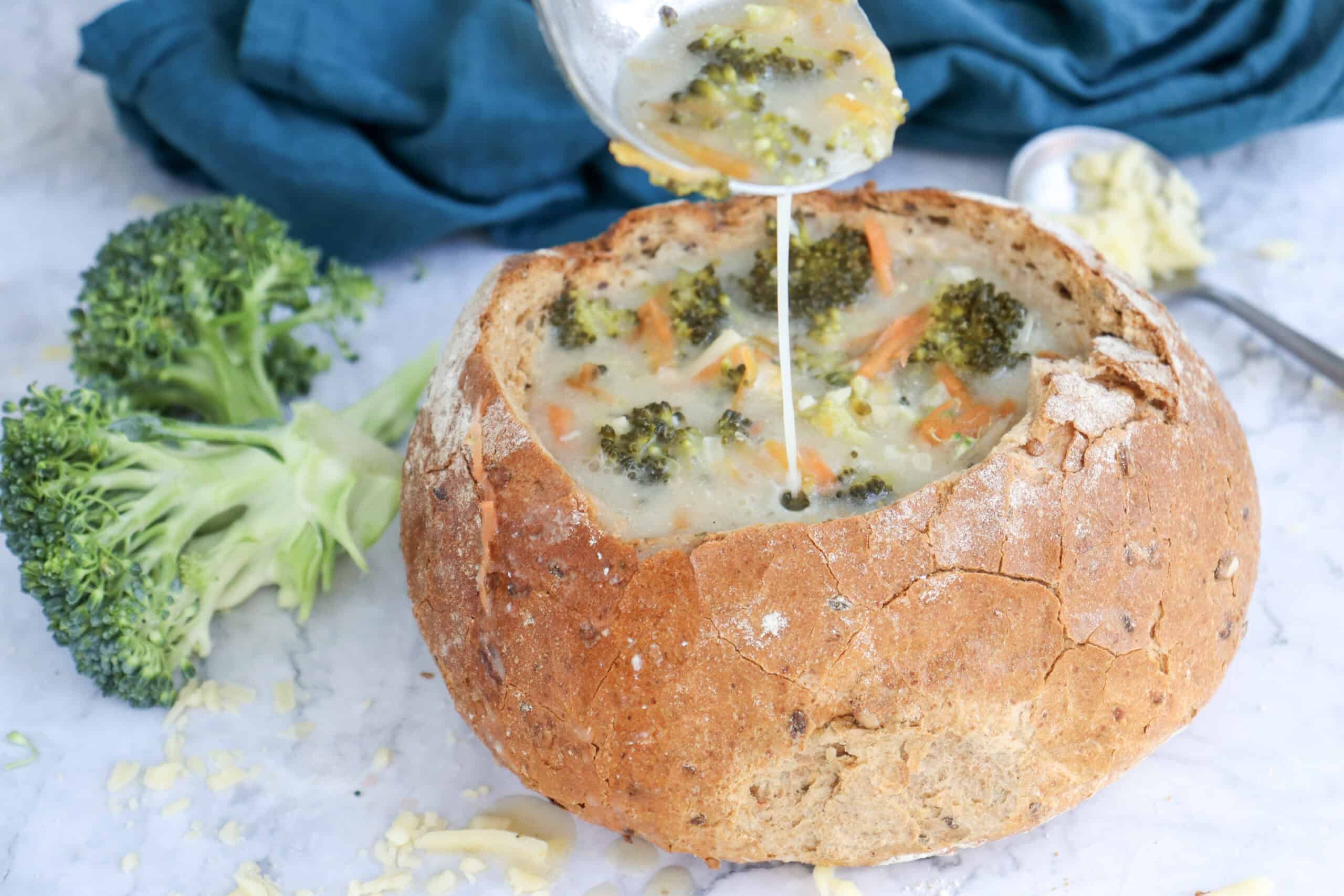 Close-up image of broccoli cheddar soup.