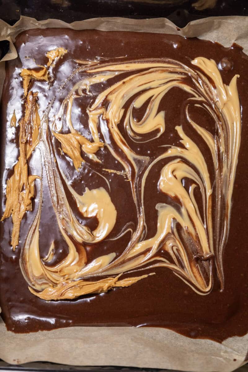 Close-up image of peanut butter drizzled on top of the mixture.