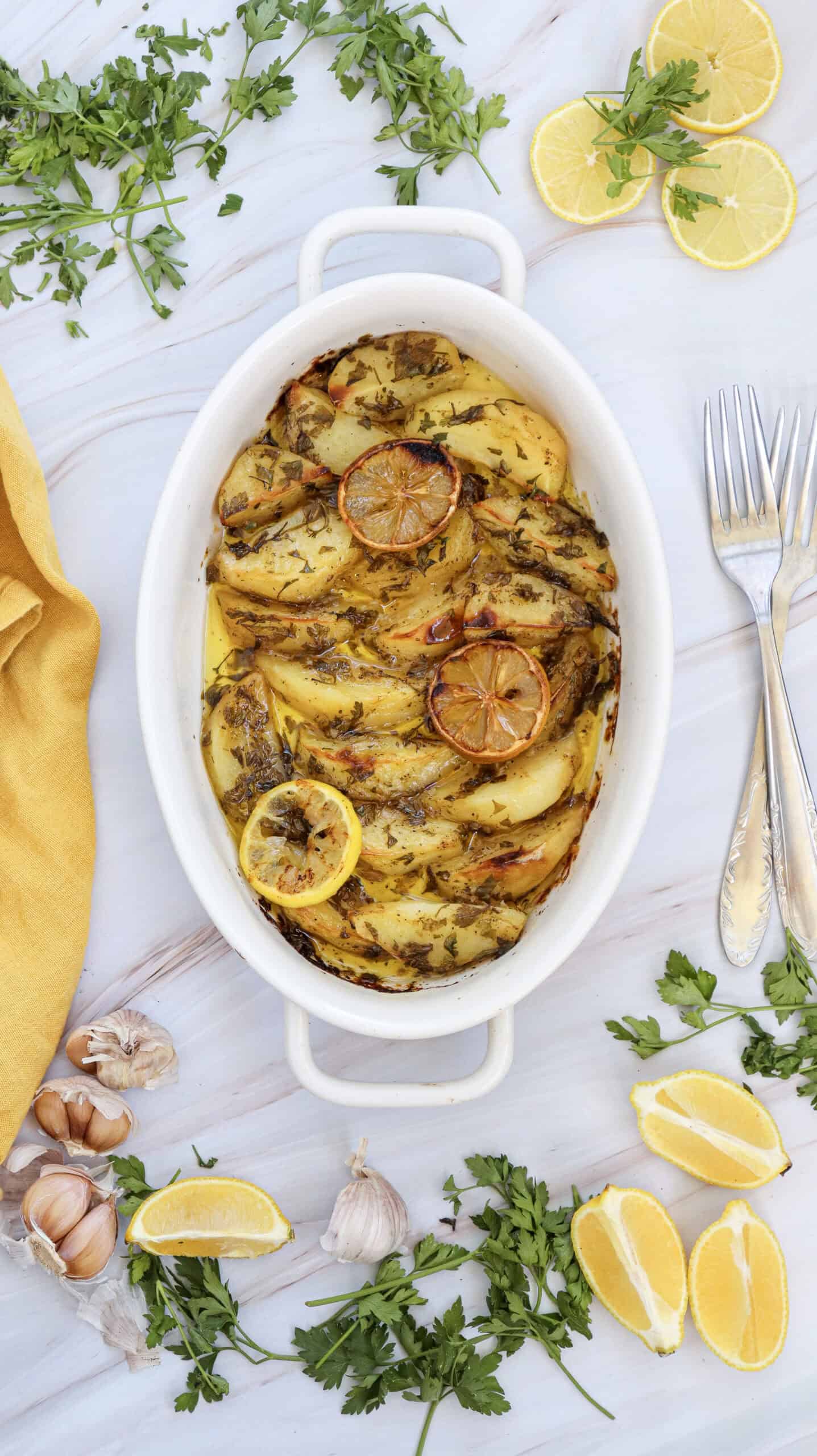 An overhead image of lemon greek potatoes in a dish.