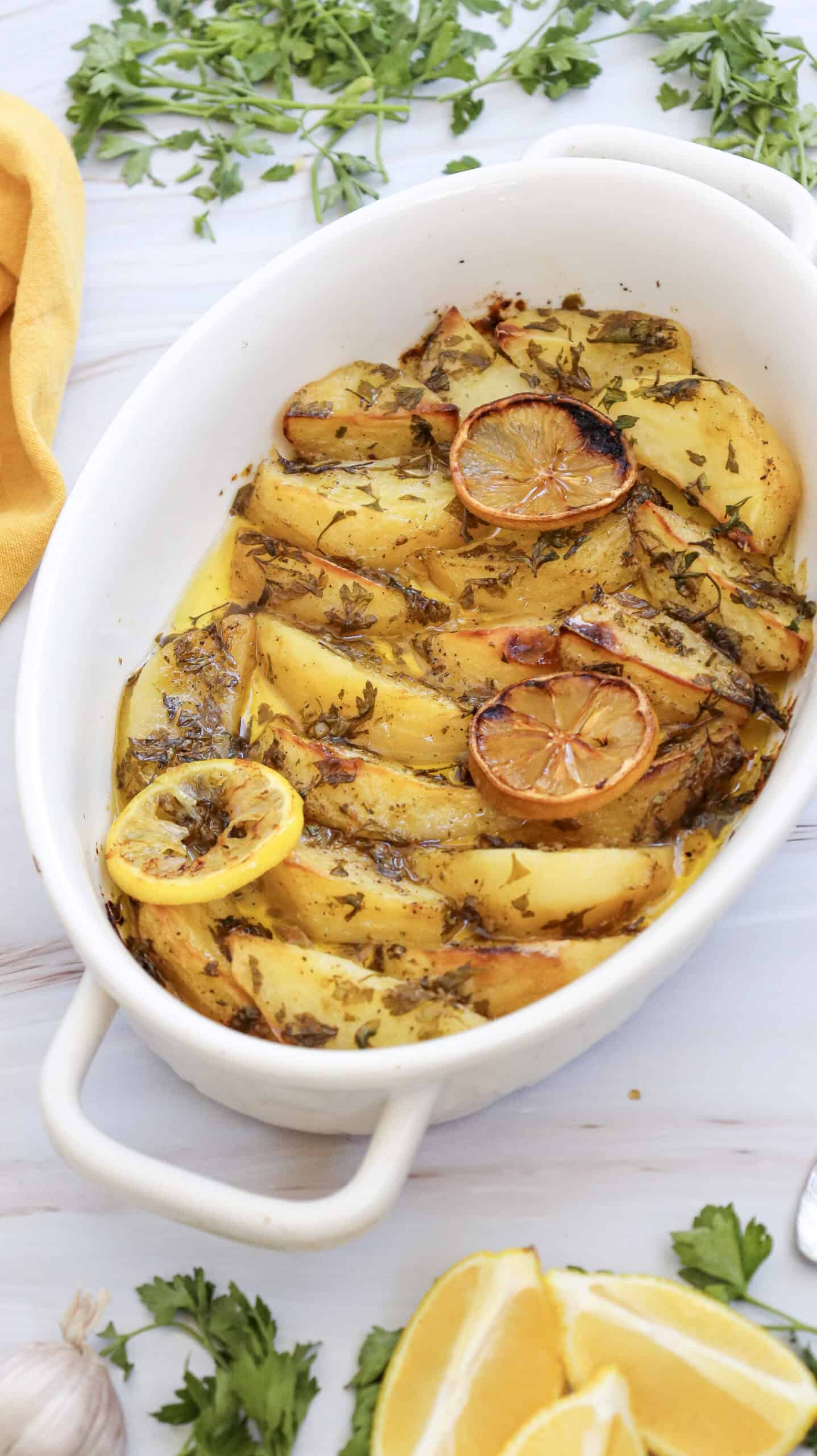 Close-up image of lemon greek potatoes in a dish.