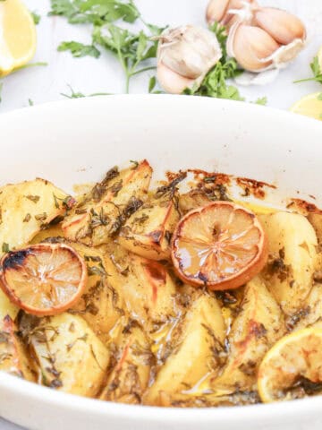 Close-up image of lemon greek potatoes in a dish.