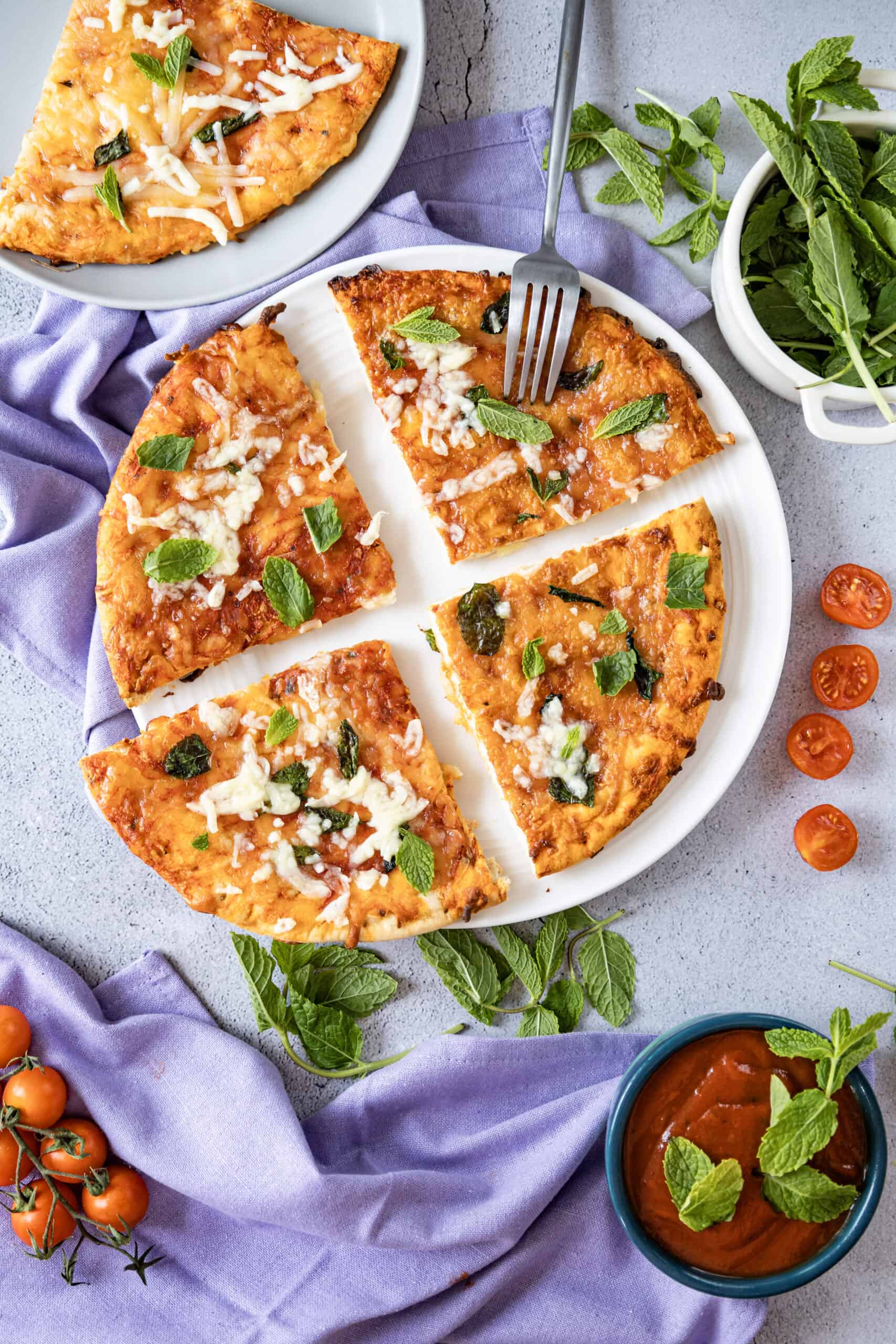 Overhead image of sliced home made margherita pizza.