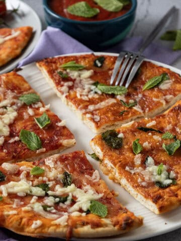 Close-up image of sliced homemade Margherita pizza.