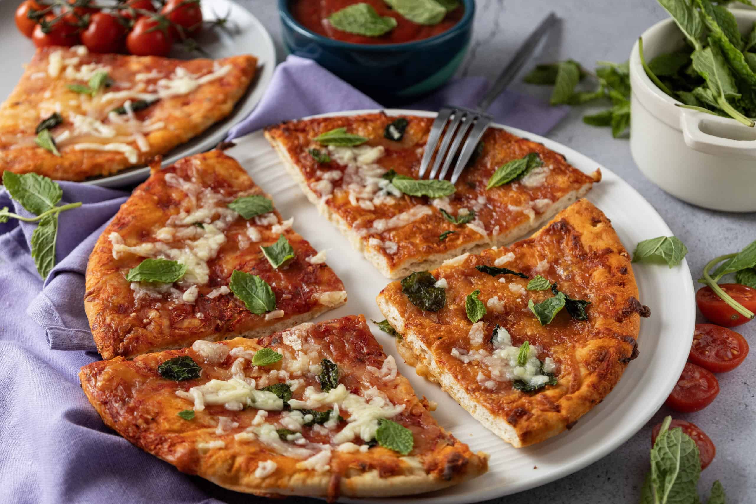 Close-up image of sliced homemade Margherita pizza.