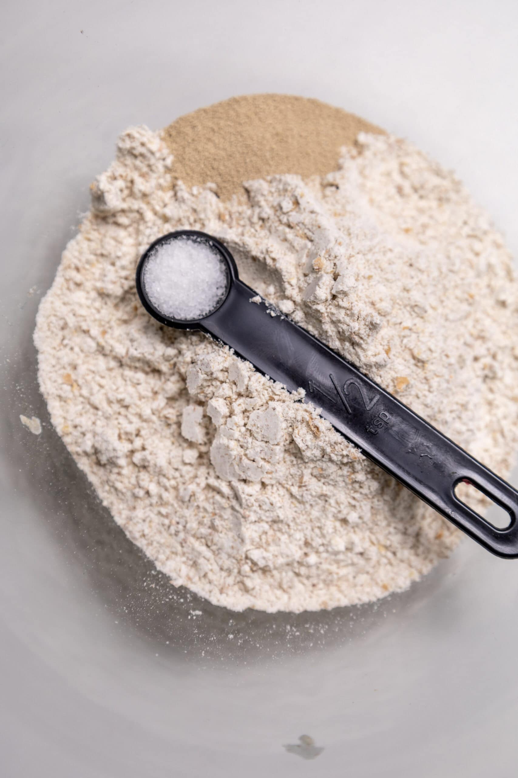 Overhead image of flour, yeast, and salt.