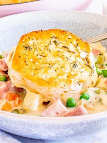 A bowl of Leftover Ham Pot Pie with Biscuits.