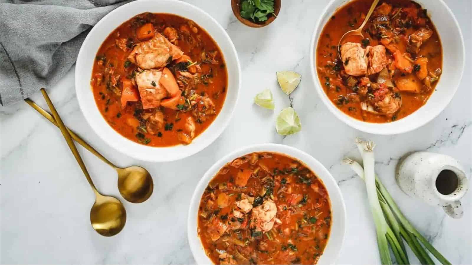 Overhead image of three bowls of moqueca.