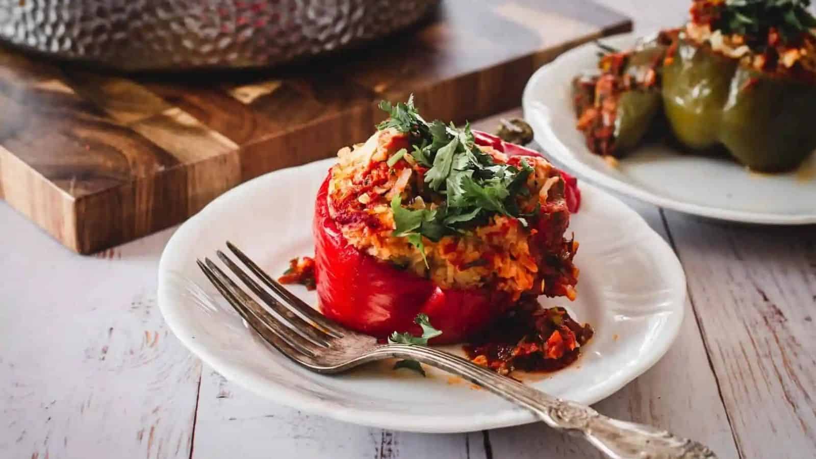 Moroccan ground turkey stuffed pepper with a fork in a  saucer.