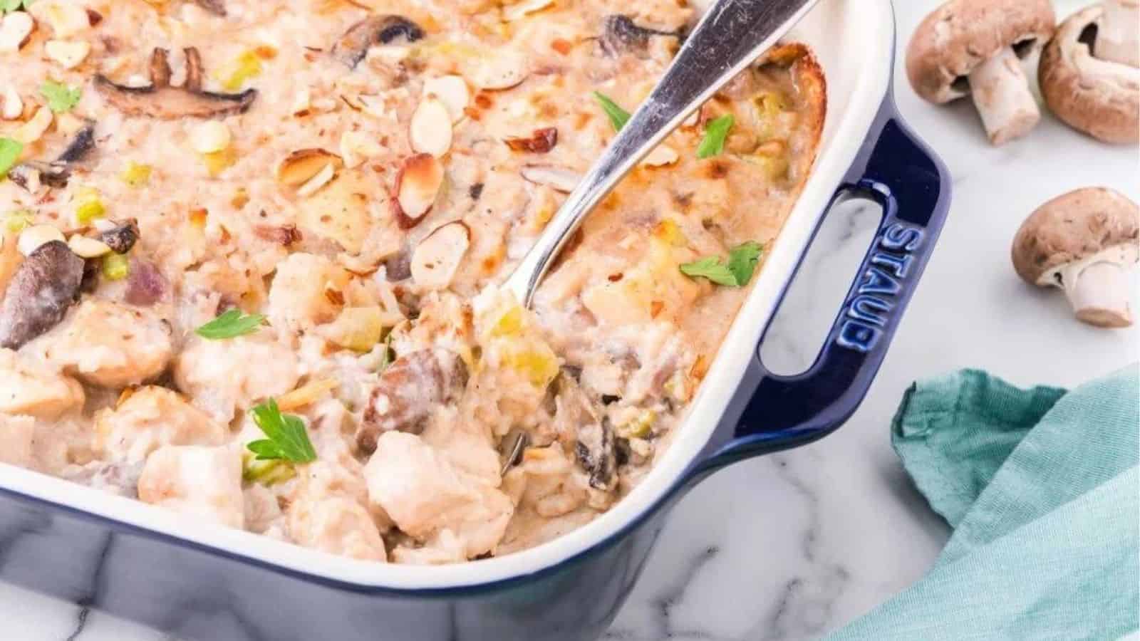 Mushroom gruyere chicken and rice casserole in a baking dish.