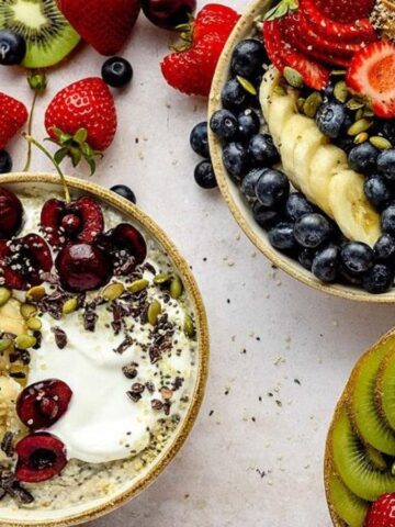 Overhead image of three variants of oatmeal brreakfast bowl.