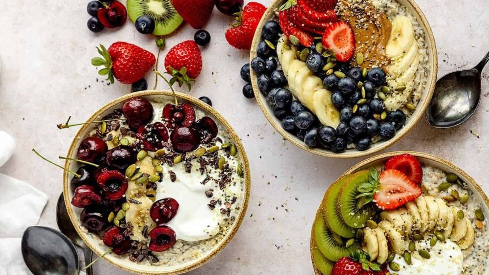 Overhead image of three variants of oatmeal brreakfast bowl.