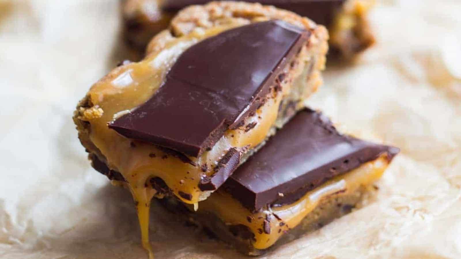 Salted caramel blondies with a chocolate chip cookie base and dark chocolate topping.