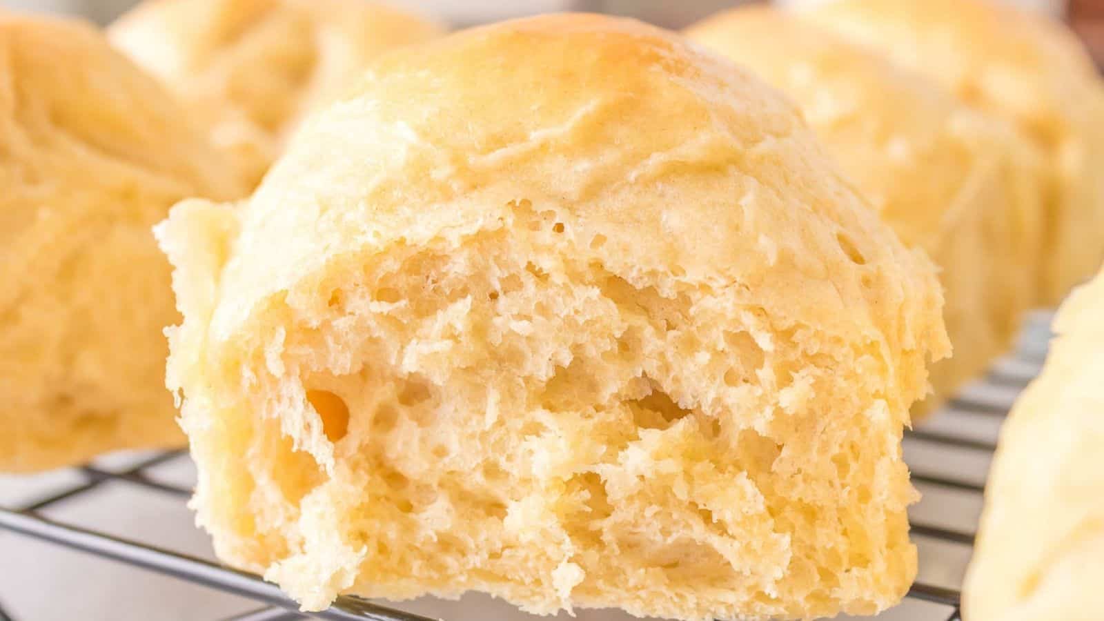 Sourdough Dinner Rolls on a cooling rack.